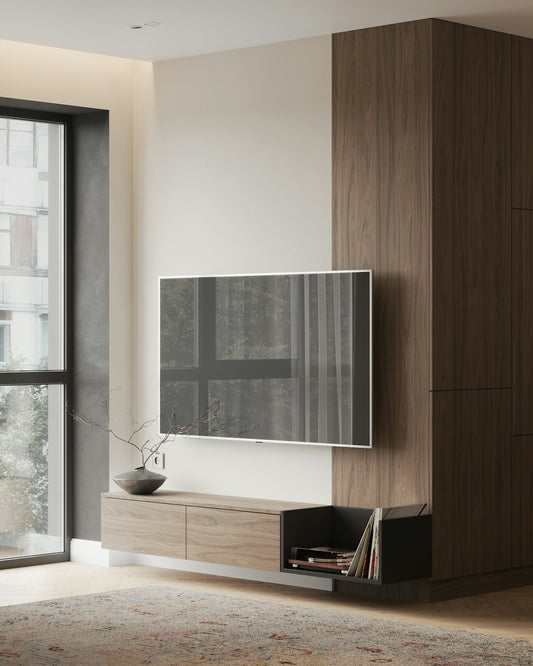 A living room with a large television on a wall
