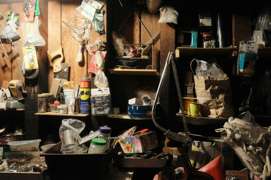 Messy, cluttered storage room filled with various household items